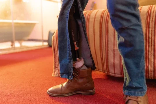 Trouser leg opening shown on a seated wearer